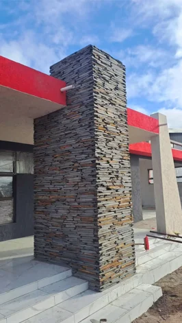 Stacked stone cladding on a building column