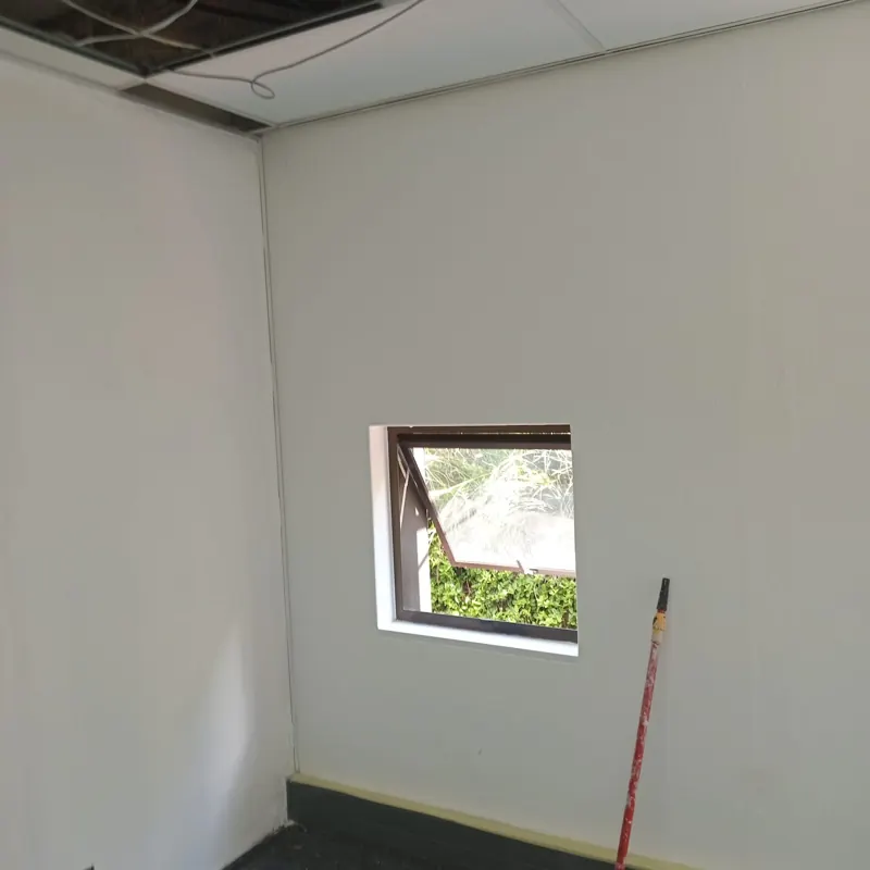 Freshly painted office wall with a clean finish around a window